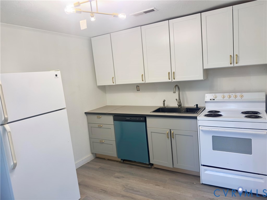 3829 Five Forks Road Pamplin, VA 23958 - Photo 55 of 65 a kitchen with granite countertop white cabinets and white appliances