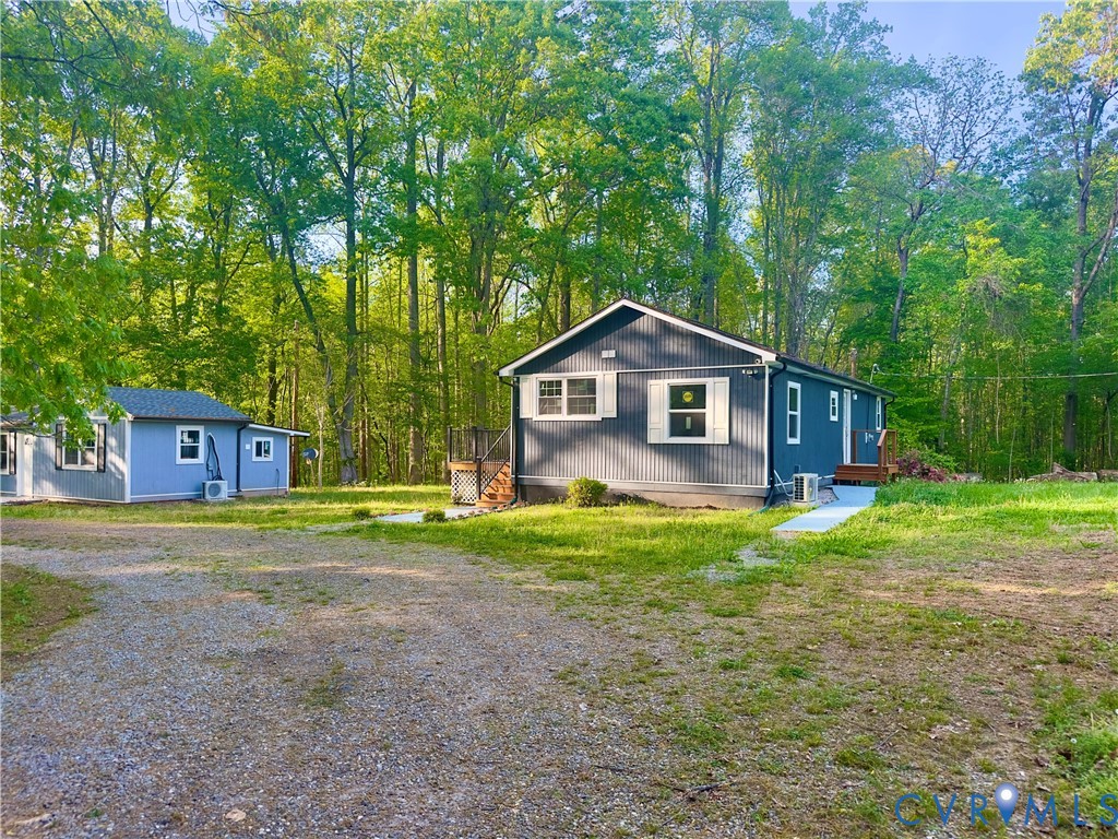 3829 Five Forks Road Pamplin, VA 23958 - Photo 6 of 65 a front view of a house with a yard and trees