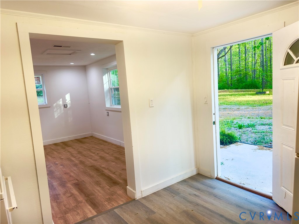 3829 Five Forks Road Pamplin, VA 23958 - Photo 62 of 65 an empty room with wooden floor and windows