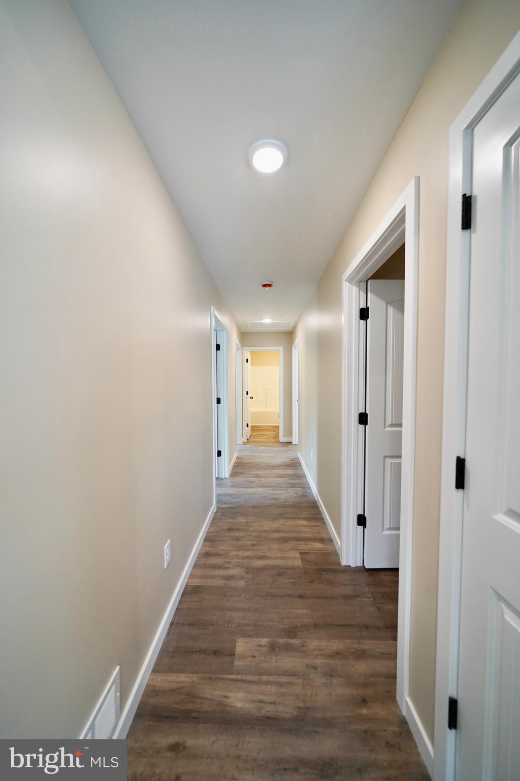 109 Main Street Ellendale, DE 19941 - Photo 12 of 29 a view of a hallway with wooden floor