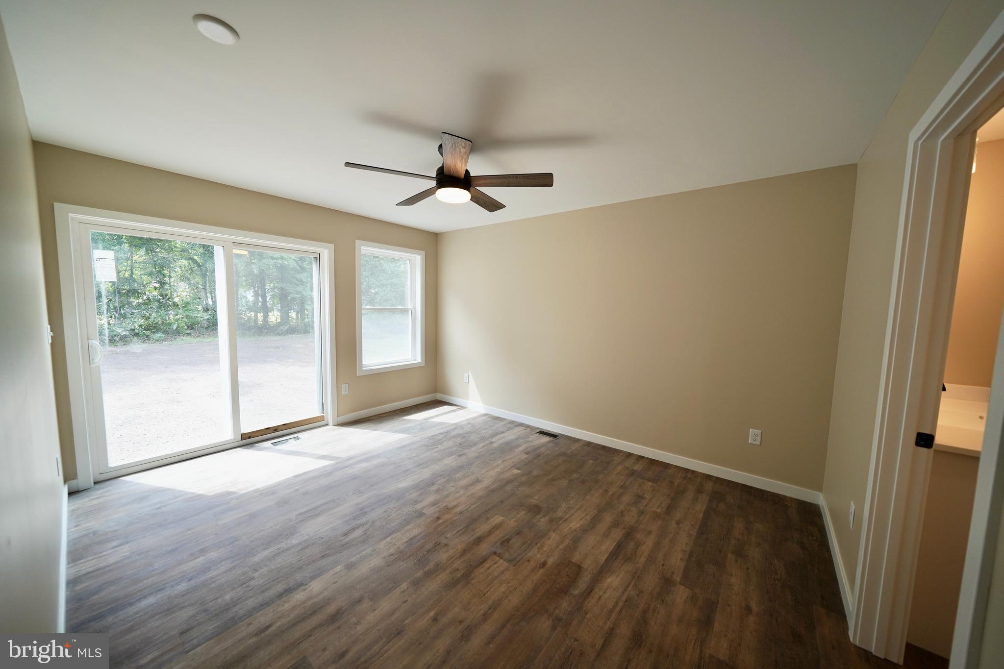 109 Main Street Ellendale, DE 19941 - Photo 18 of 29 wooden floor in an empty room with a window
