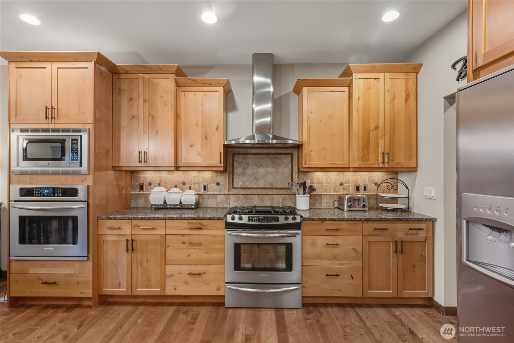 8424 Double Ditch Road Lynden, WA 98264 - Photo 12 of 39 a kitchen with stainless steel appliances a stove and a refrigerator