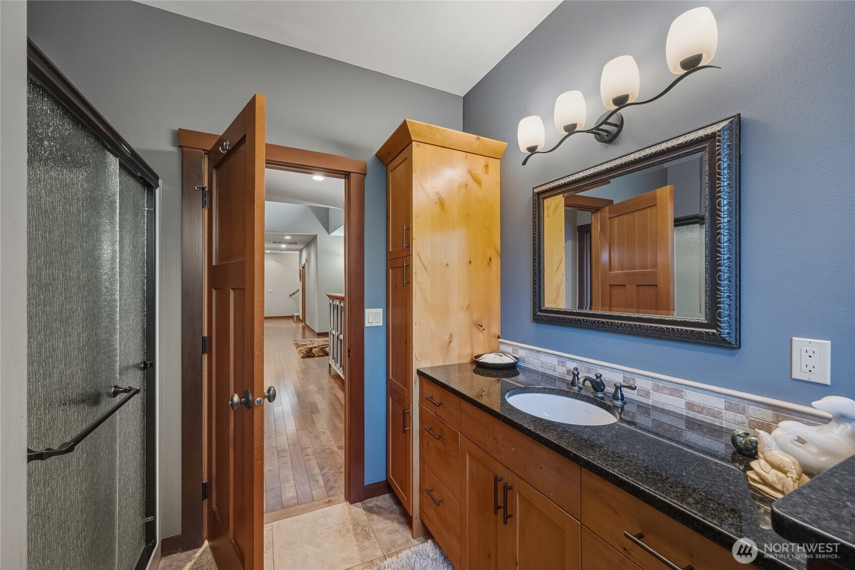 8424 Double Ditch Road Lynden, WA 98264 - Photo 23 of 39 a bathroom with a sink a light fixture and a mirror