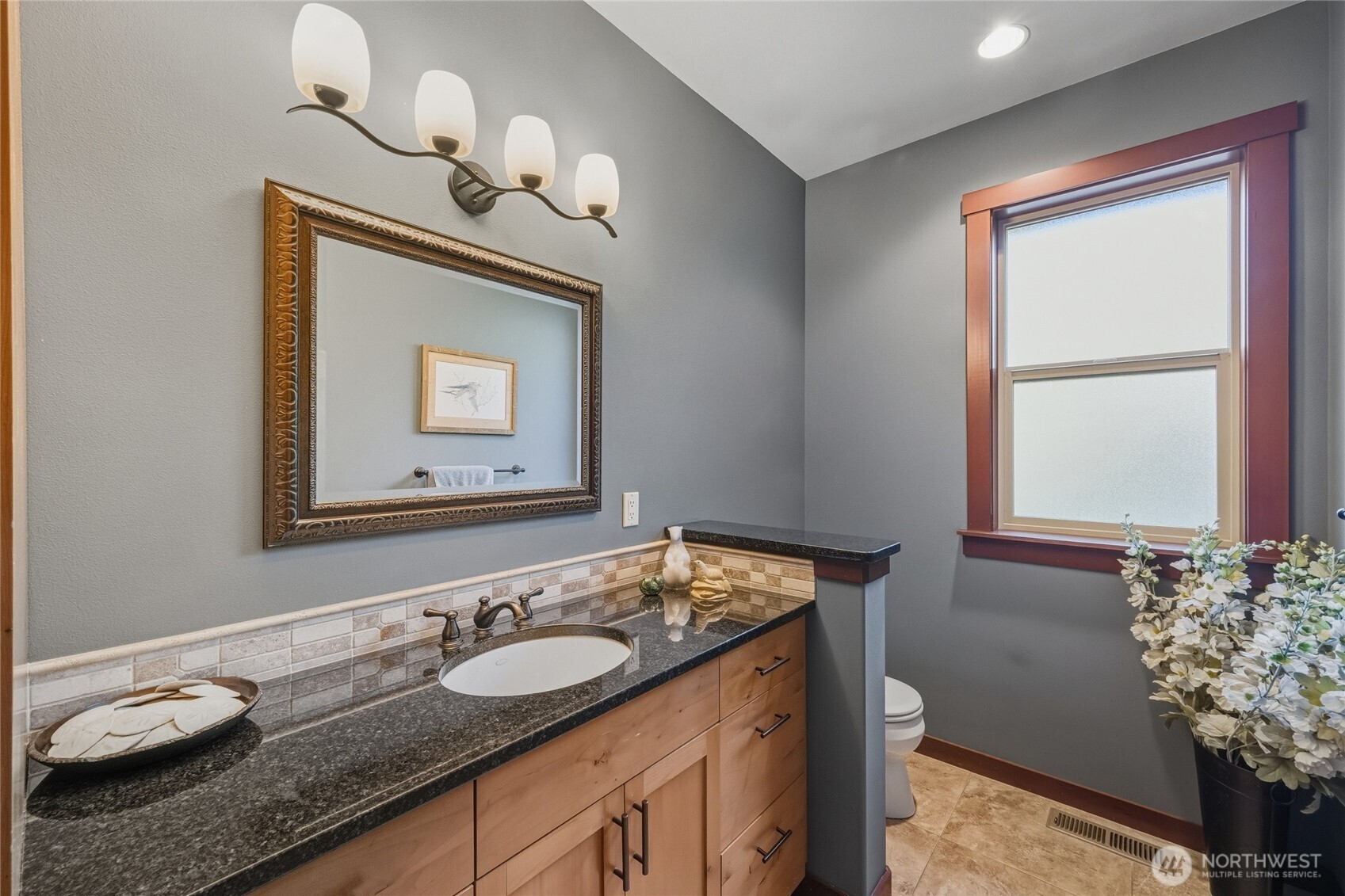 8424 Double Ditch Road Lynden, WA 98264 - Photo 24 of 39 a bathroom with a granite countertop sink and a mirror