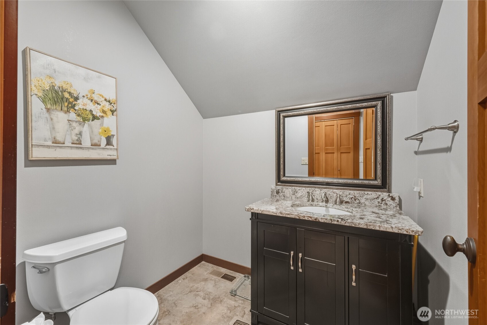 8424 Double Ditch Road Lynden, WA 98264 - Photo 30 of 39 a bathroom with a toilet sink and mirror
