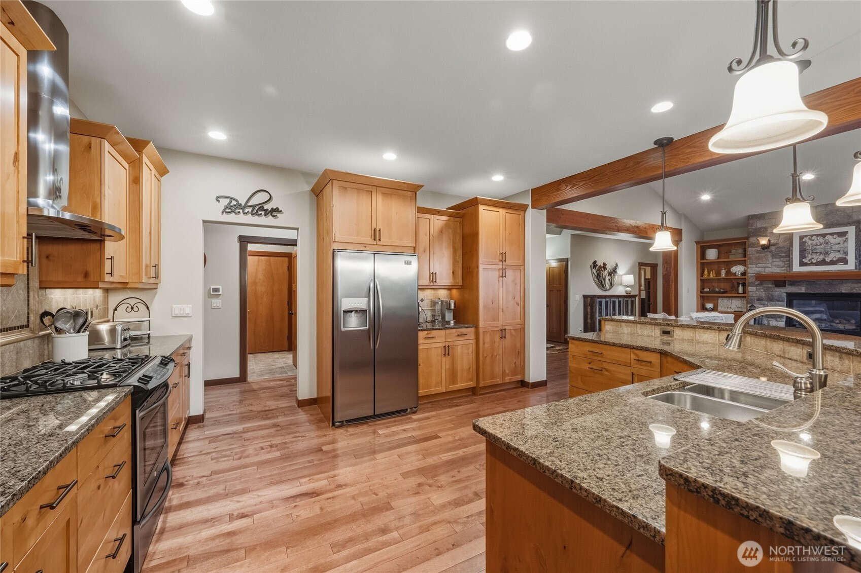8424 Double Ditch Road Lynden, WA 98264 - Photo 9 of 39 a kitchen with stainless steel appliances granite countertop a sink a stove and a refrigerator