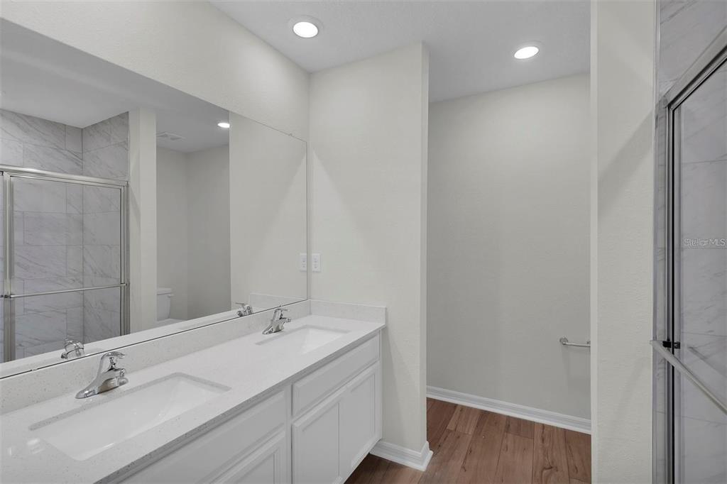 2 Prince Eric Lane Palm Coast, FL 32164 - Photo 17 of 24 a bathroom with a double vanity sink and a mirror