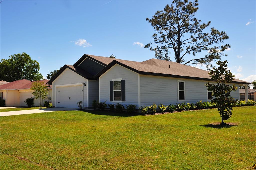 2 Prince Eric Lane Palm Coast, FL 32164 - Photo 19 of 24 a view of a house with a yard
