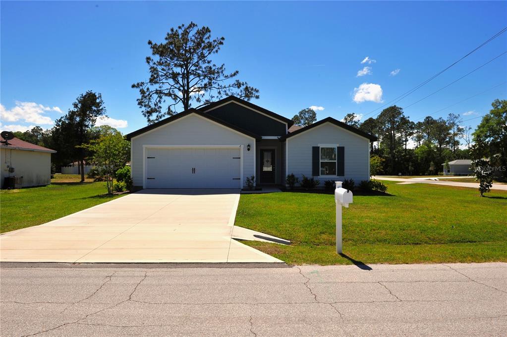 2 Prince Eric Lane Palm Coast, FL 32164 - Photo 20 of 24 a house view with a garden space