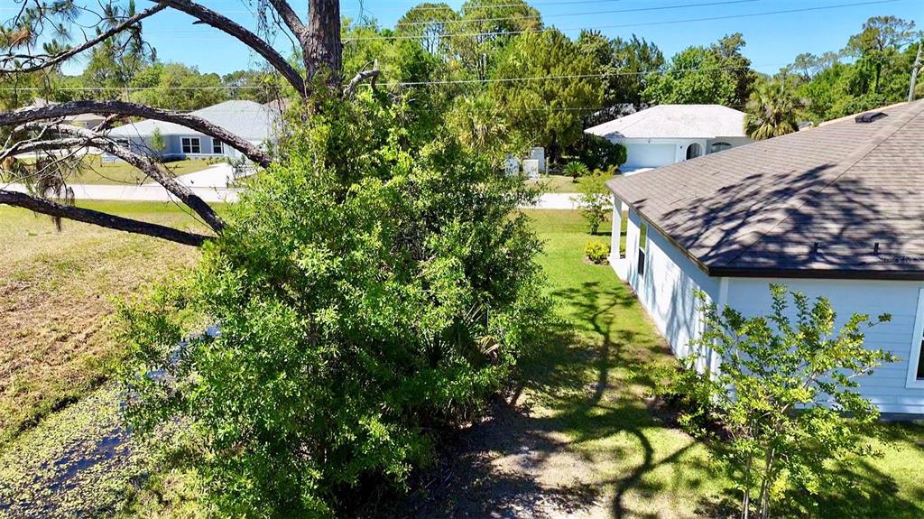2 Prince Eric Lane Palm Coast, FL 32164 - Photo 22 of 24 a view of a backyard with plants