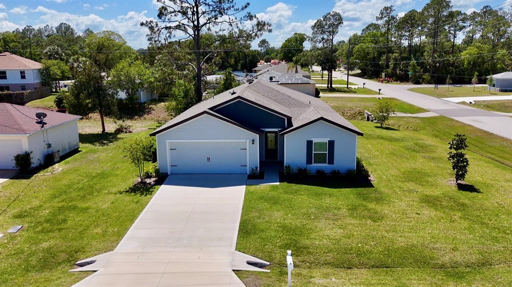 2 Prince Eric Lane Palm Coast, FL 32164 - Photo 23 of 24 a house view with swimming pool and yard