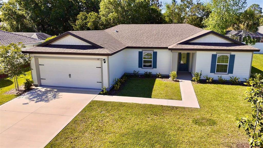 2 Prince Eric Lane Palm Coast, FL 32164 - Photo 24 of 24 a view of house with garden space and swimming pool