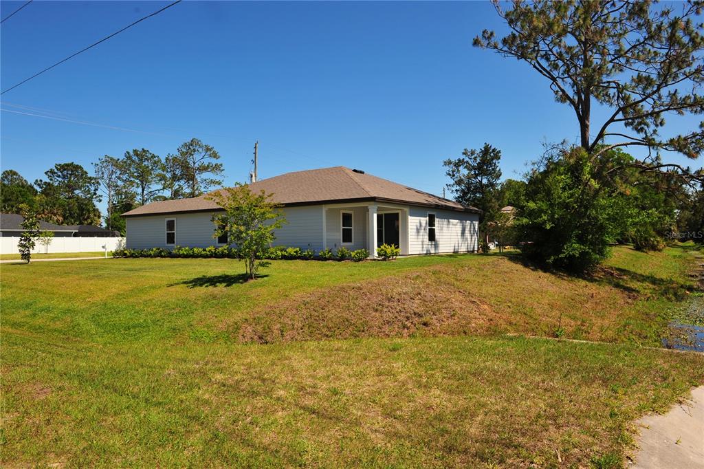 2 Prince Eric Lane Palm Coast, FL 32164 - Photo 4 of 24 a front view of a house with a yard
