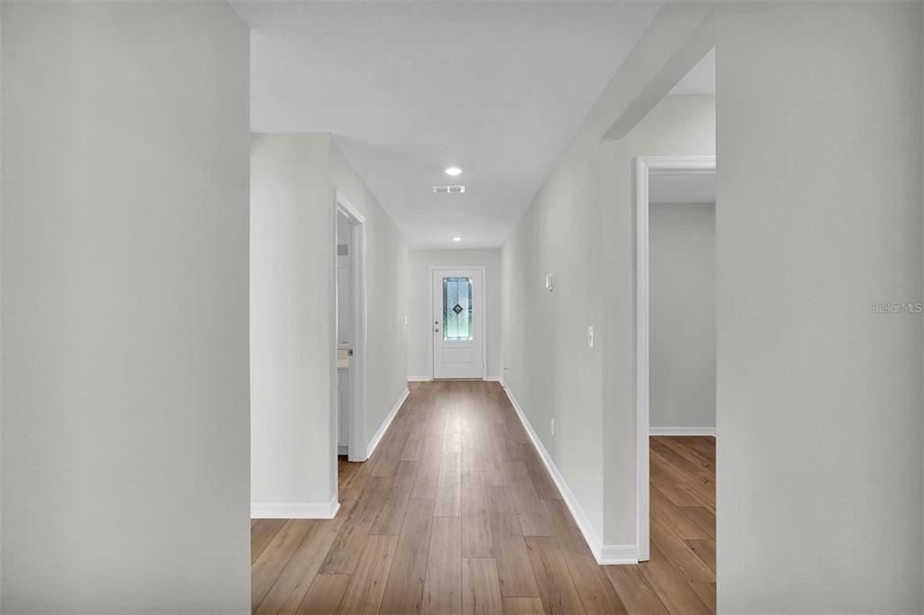 2 Prince Eric Lane Palm Coast, FL 32164 - Photo 5 of 24 a view of hallway with wooden floor
