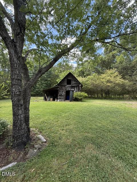 3415 Mt Willing Road Efland, NC 27243 - Photo 30 of 36 a big yard with lots of green space and trees