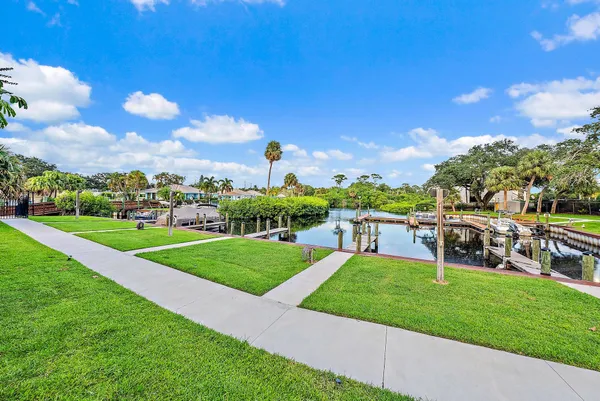 a view of a park with houses