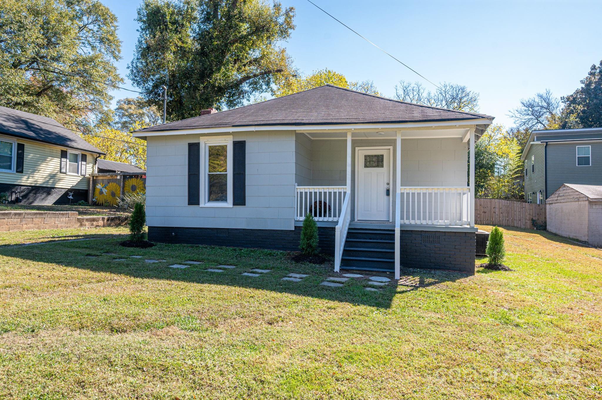 1811 Hemlock Avenue Gastonia, NC 28054 - Photo 1 of 31 a front view of a house with a yard