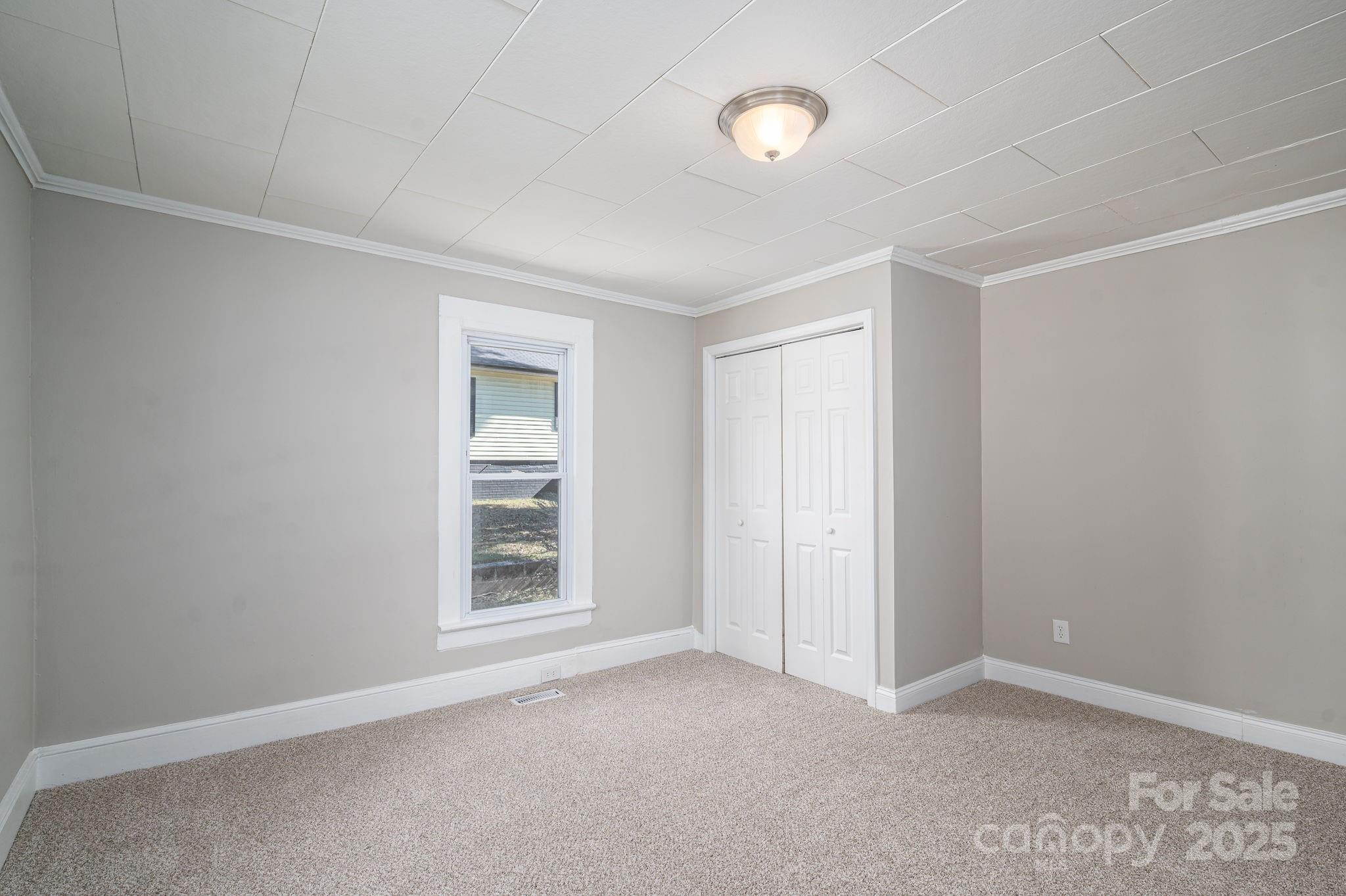 1811 Hemlock Avenue Gastonia, NC 28054 - Photo 13 of 31 an empty room with windows