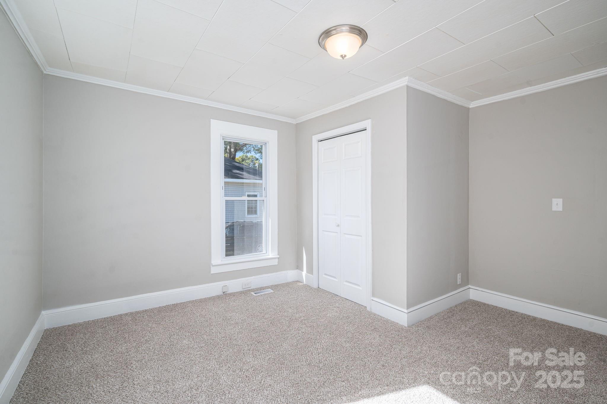 1811 Hemlock Avenue Gastonia, NC 28054 - Photo 14 of 31 an empty room with windows