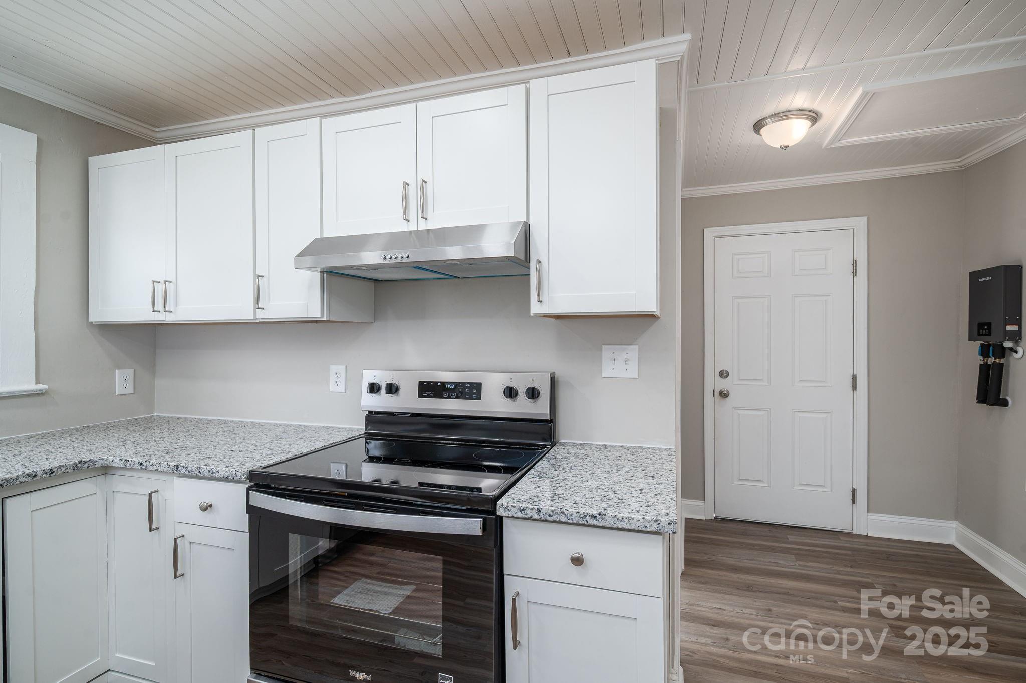 1811 Hemlock Avenue Gastonia, NC 28054 - Photo 21 of 31 a stove top oven sitting inside of a kitchen