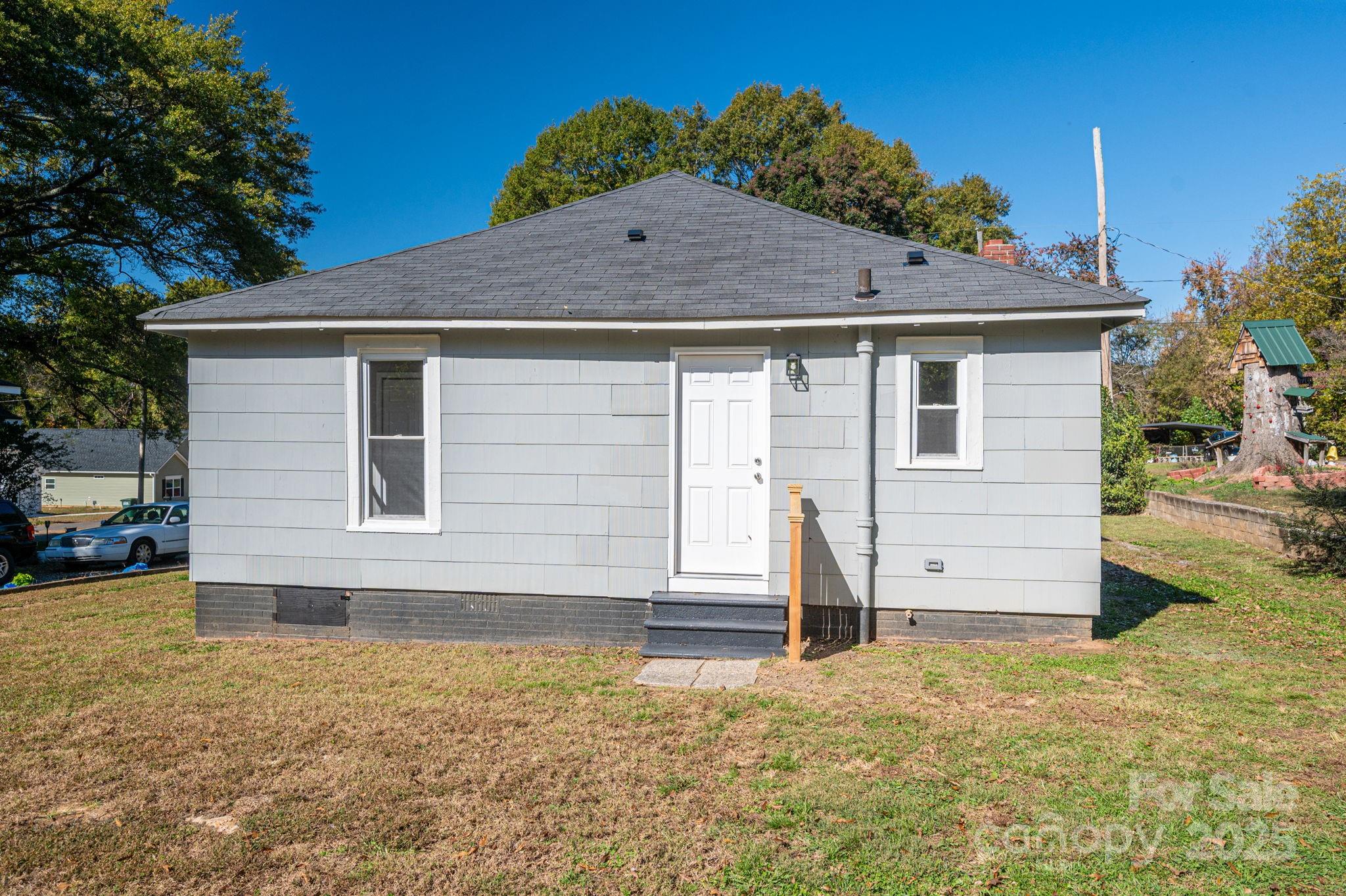 1811 Hemlock Avenue Gastonia, NC 28054 - Photo 26 of 31 a front view of a house with a yard
