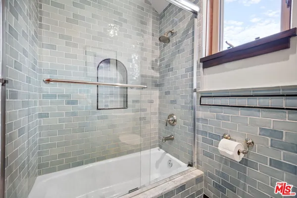 a bathroom with a sink and bathtub