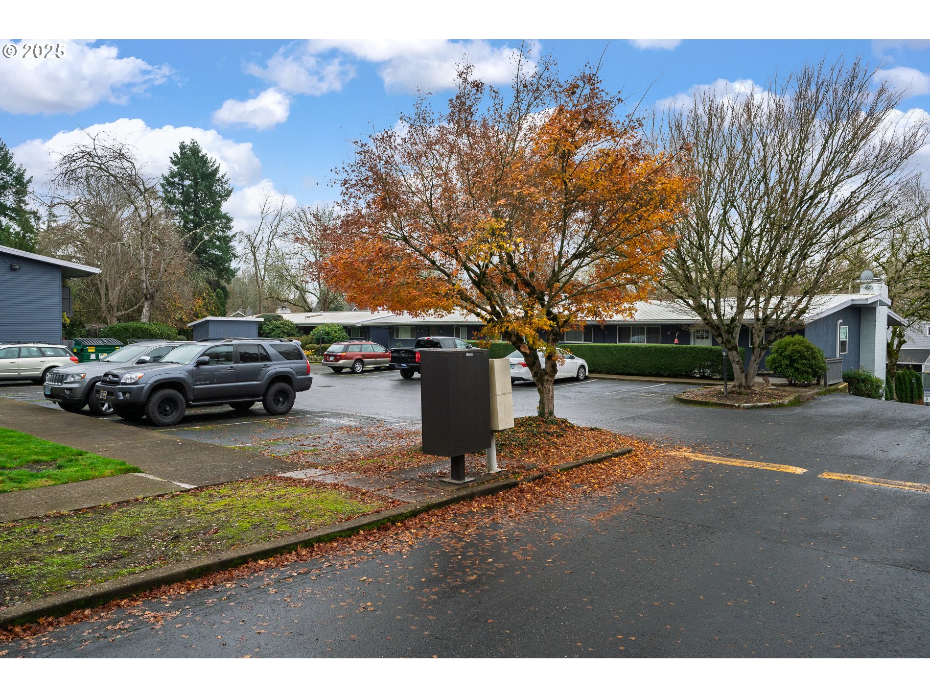 10090 Southwest Beaverton Hillsdale Highway, Unit 16 Beaverton, OR 97005 - Photo 34 of 39 a view of a street with a building and trees in the background