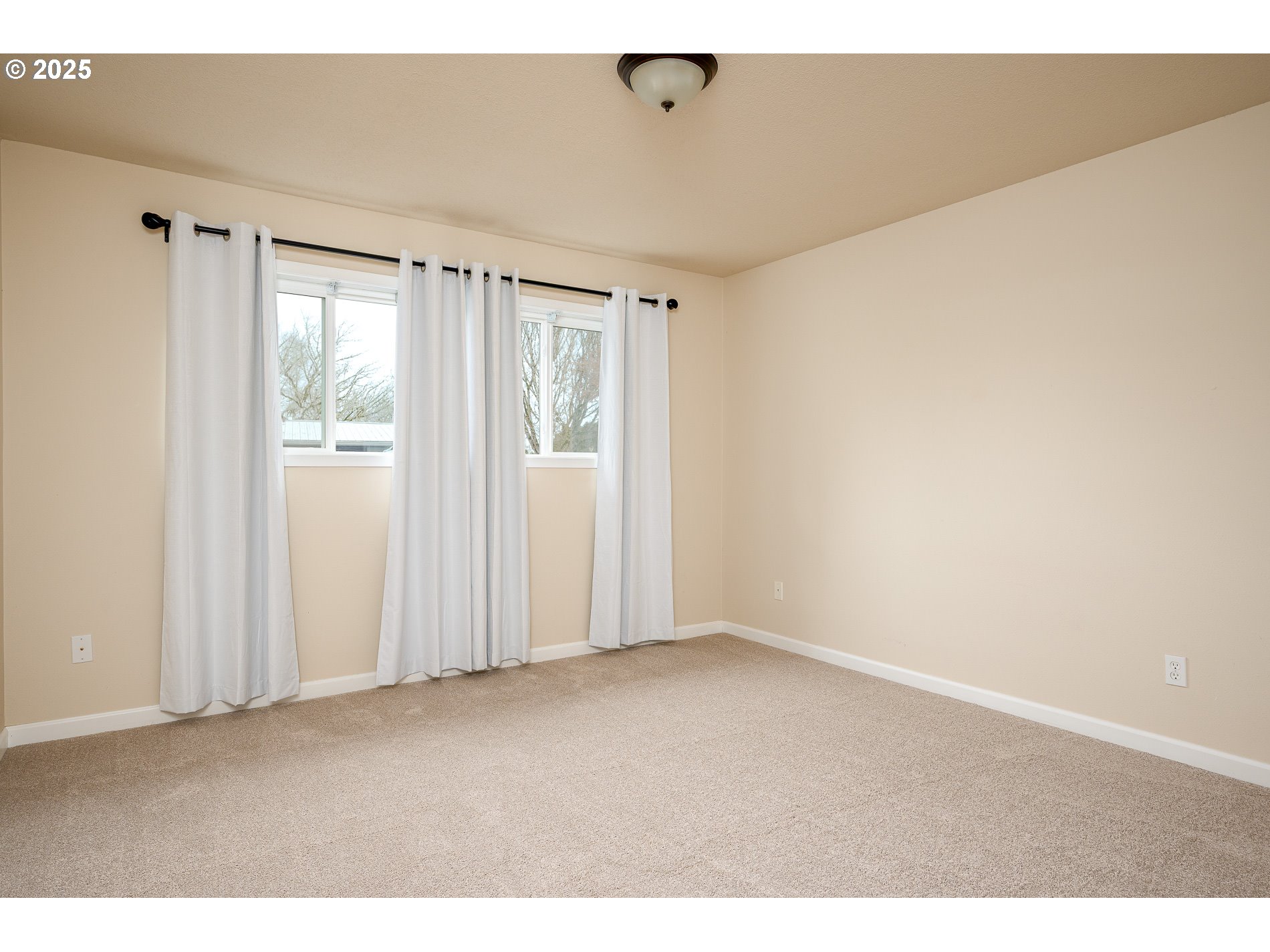 10090 Southwest Beaverton Hillsdale Highway, Unit 16 Beaverton, OR 97005 - Photo 5 of 39 a view of an empty room with a window