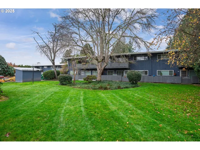 a view of a house with a back yard