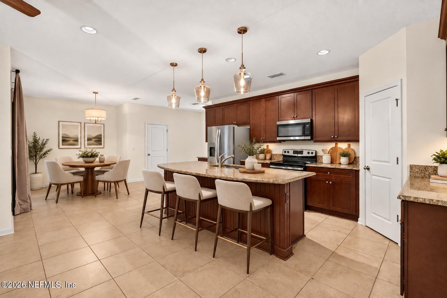 3276 Chestnut Ridge Way Orange Park, FL 32065 - Photo 7 of 37 Warm Modern Kitchen with Slim Barstools