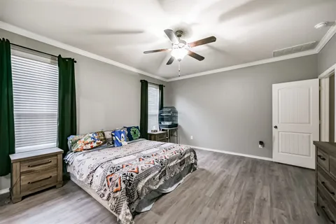 a spacious bathroom with a granite countertop sink mirror and bathtub