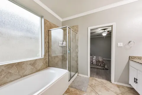 a view of livingroom with furniture hardwood floor and a ceiling fan