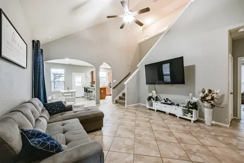 a living room with furniture and a flat screen tv
