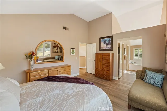 a bedroom with a bed and dresser