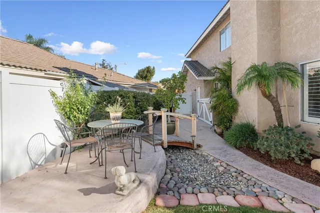 swimming pool view with a seating space