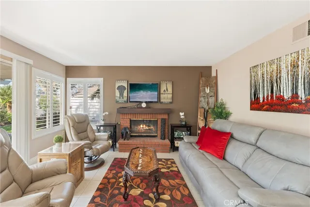 a living room with furniture or couch and a fireplace