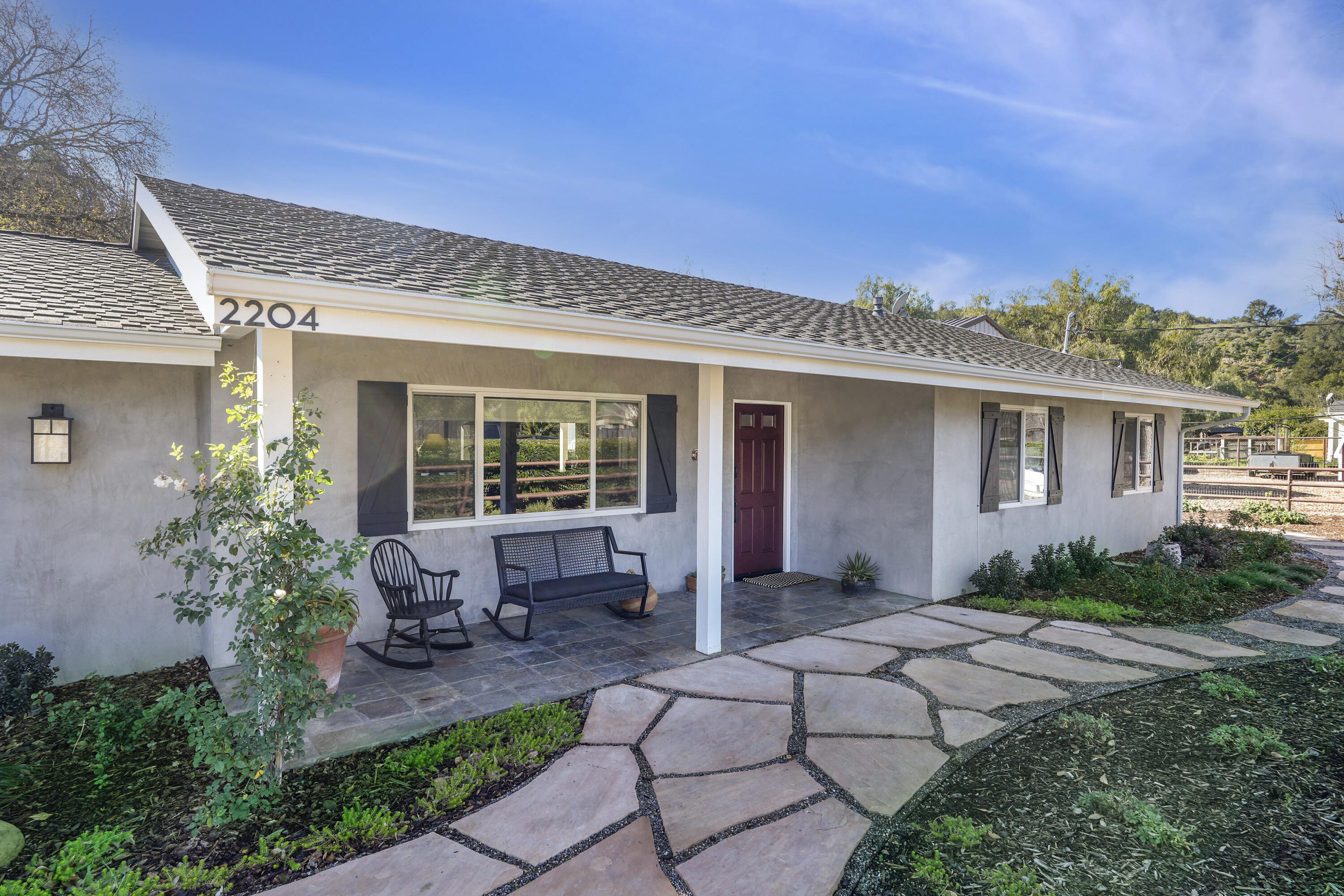a front view of a house with garden