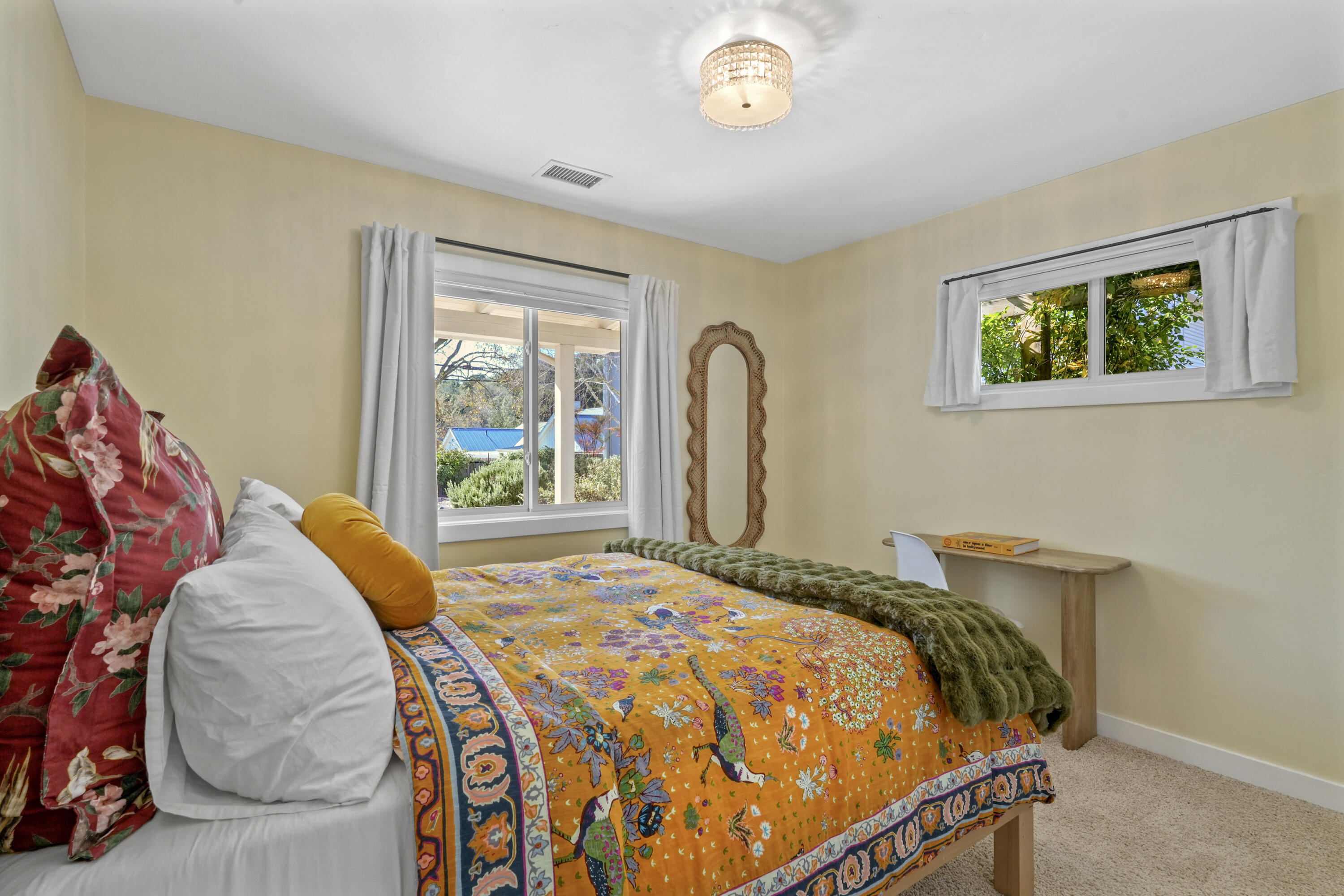 2204 Alamo Pintado Road Solvang, CA 93463 - Photo 12 of 17 a bed sitting in a bedroom next to a window