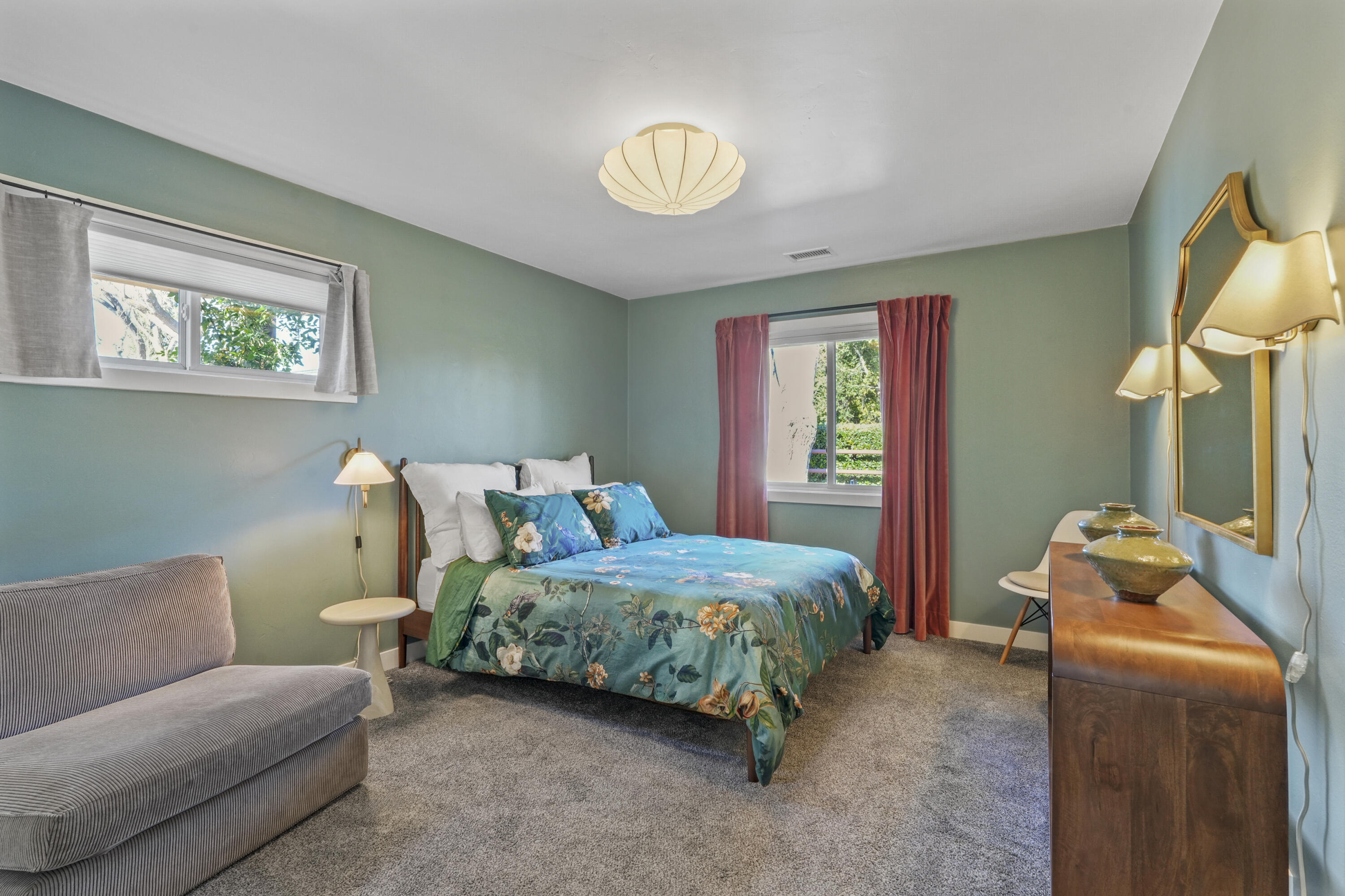 2204 Alamo Pintado Road Solvang, CA 93463 - Photo 13 of 17 a bedroom with a bed and a chandelier