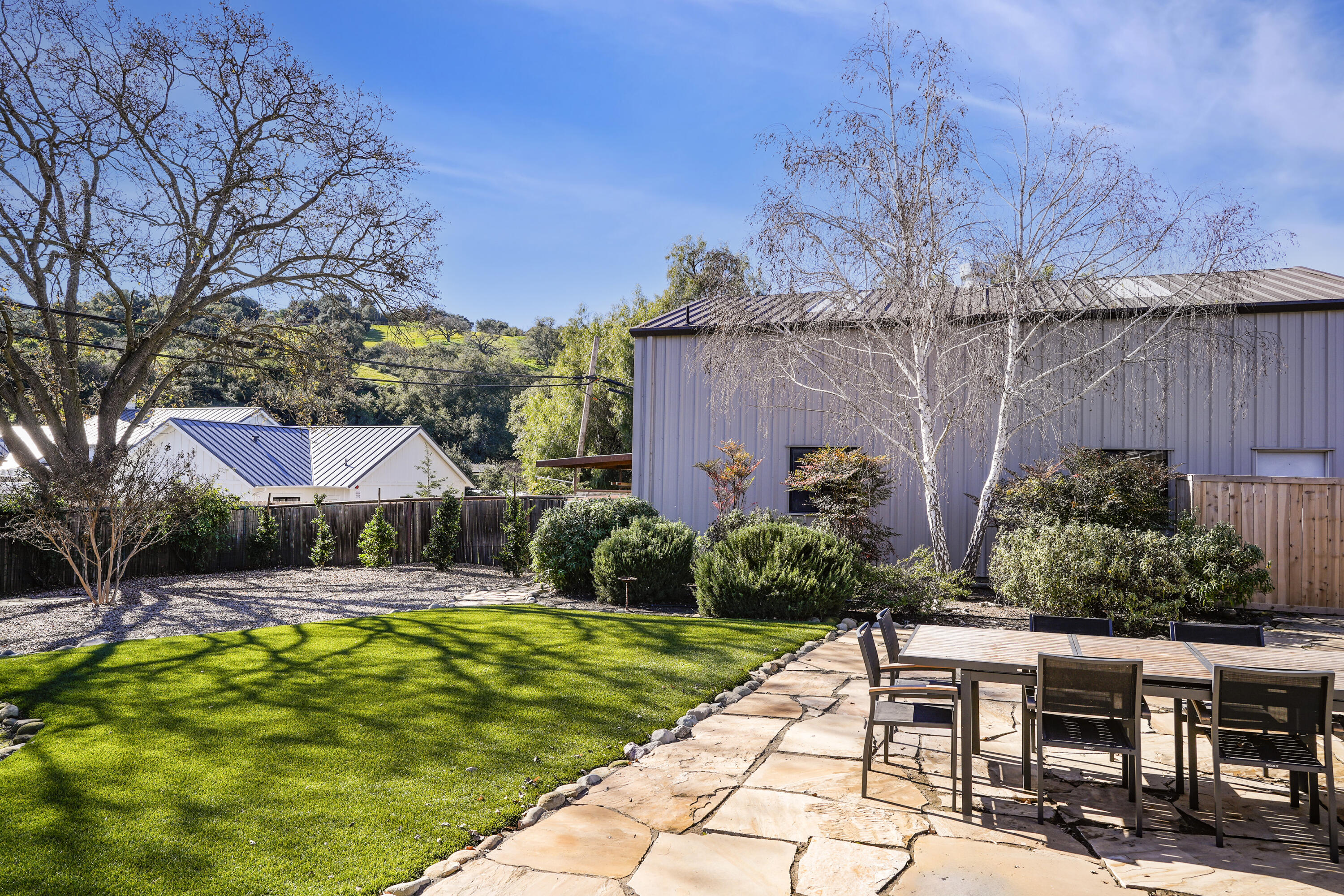 2204 Alamo Pintado Road Solvang, CA 93463 - Photo 14 of 17 a view of a backyard with plants and patio