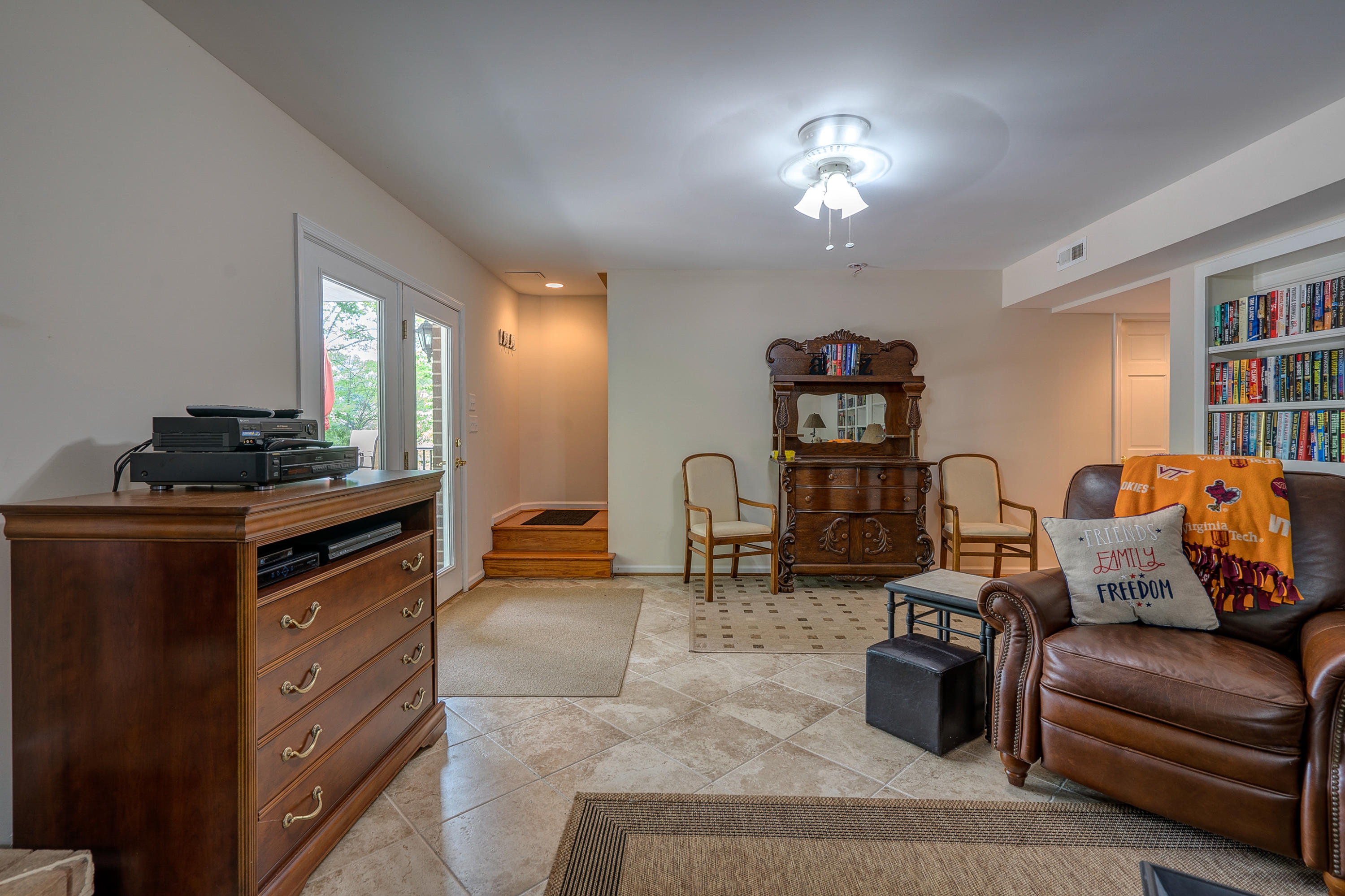 161 Highland Lake Road Union Hall, VA 24176 - Photo 32 of 45 a living room with furniture a lamp and a window
