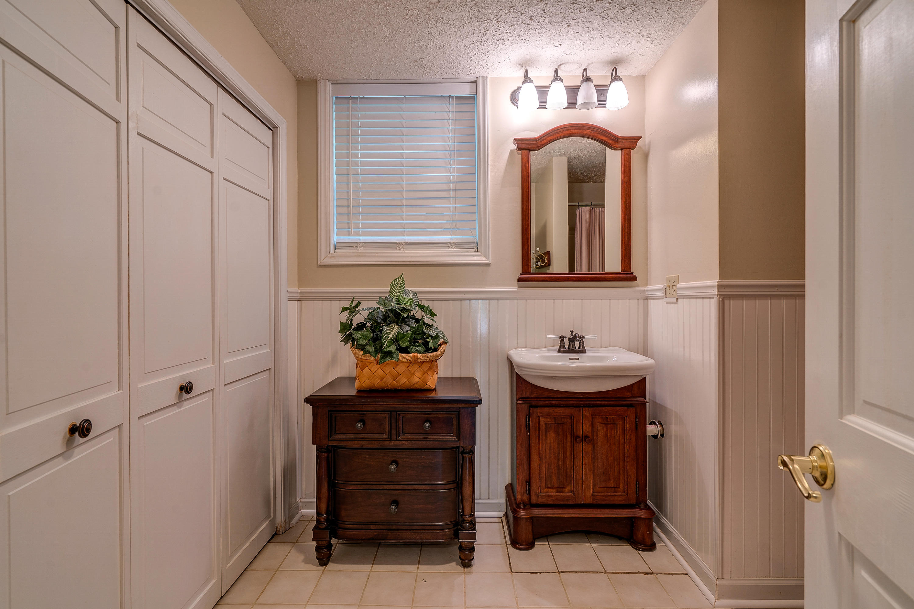 161 Highland Lake Road Union Hall, VA 24176 - Photo 33 of 45 a bathroom with a sink and a mirror