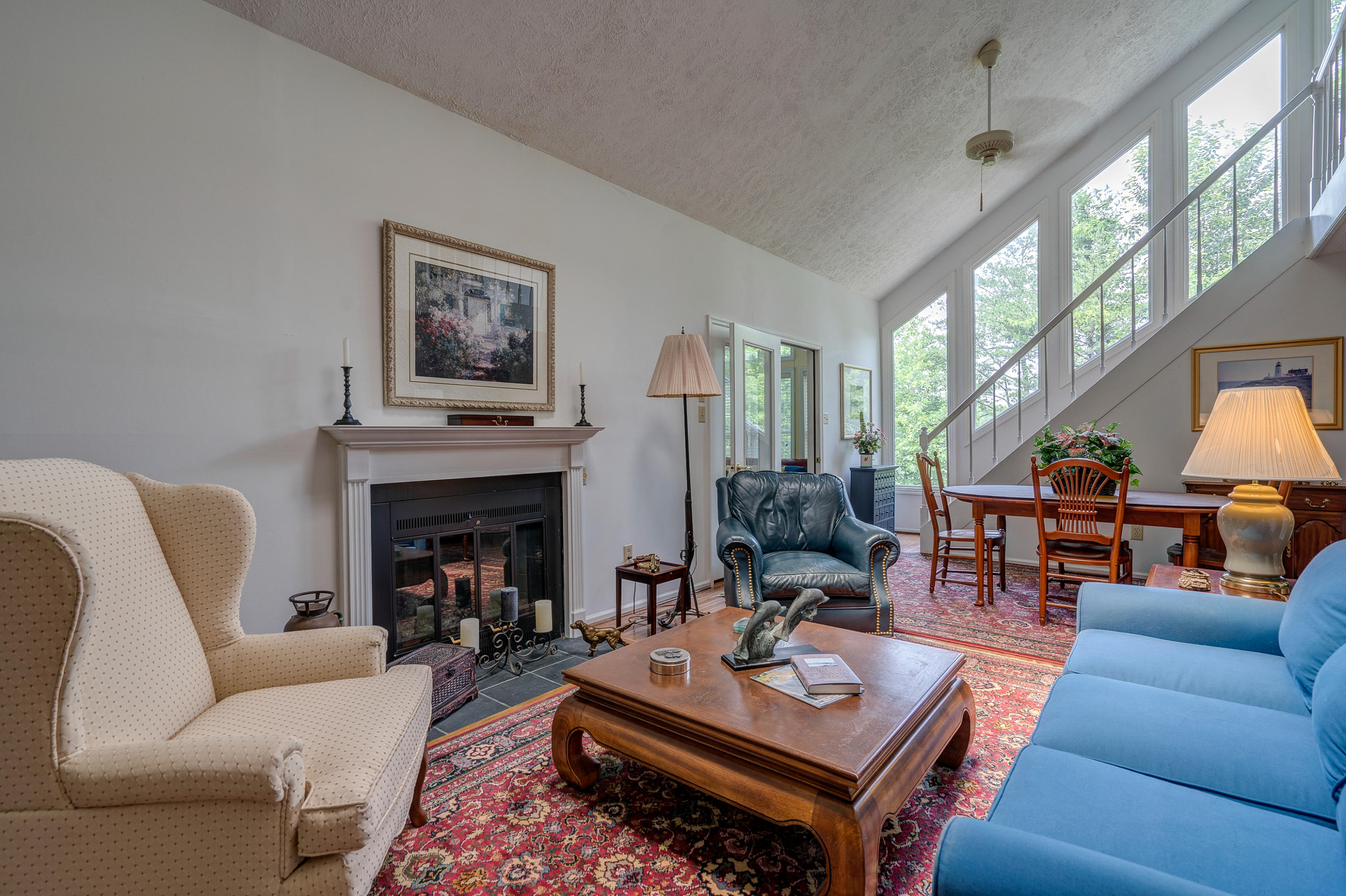 161 Highland Lake Road Union Hall, VA 24176 - Photo 10 of 45 a living room with furniture a fireplace and a large window