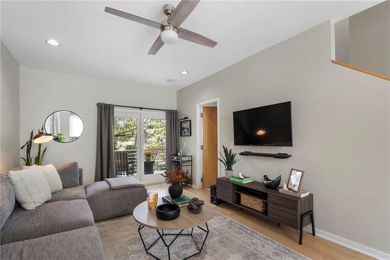 2188 Millennium Way Brookhaven, GA 30319 - Photo 21 of 52 a living room with furniture and a flat screen tv