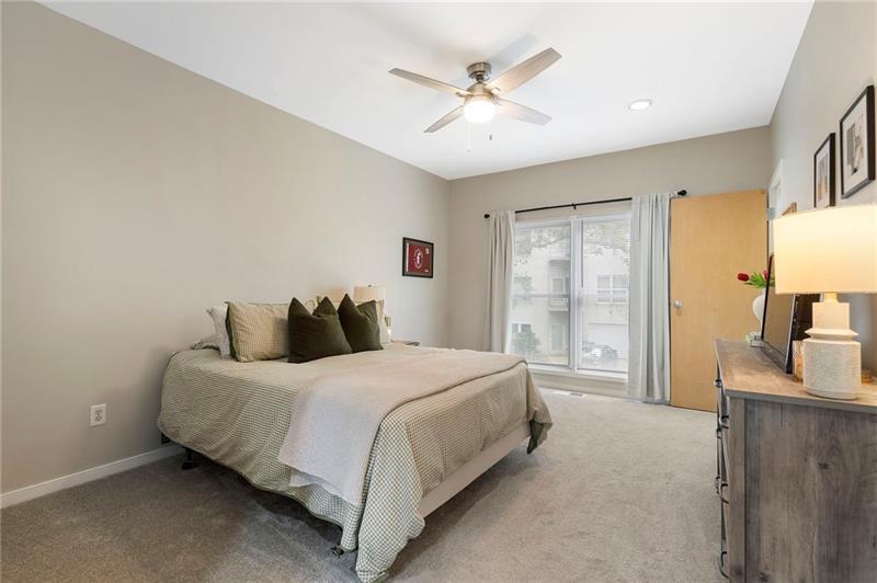 2188 Millennium Way Brookhaven, GA 30319 - Photo 30 of 52 a bedroom with a large bed and a chandelier