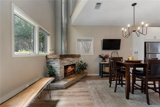 a view of a livingroom with furniture and a fireplace