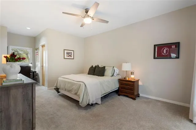 a bedroom with a bed and a television