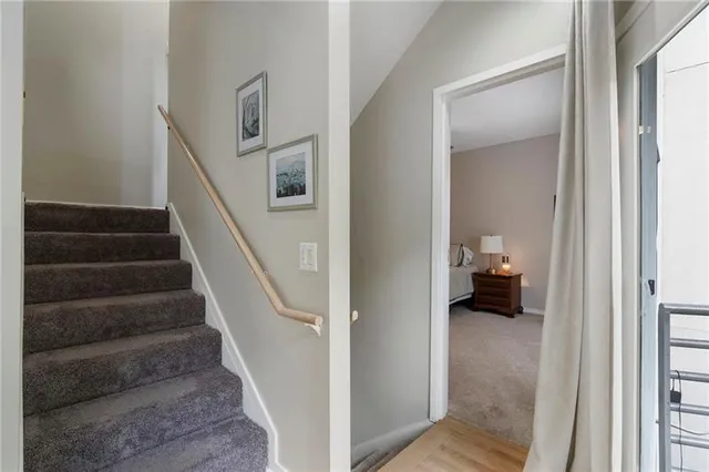 a view of balcony with wooden floor and fence
