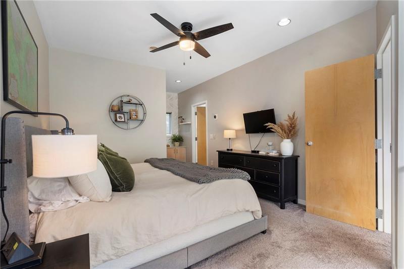 2188 Millennium Way Brookhaven, GA 30319 - Photo 39 of 52 a bedroom with a bed flat screen tv and a window