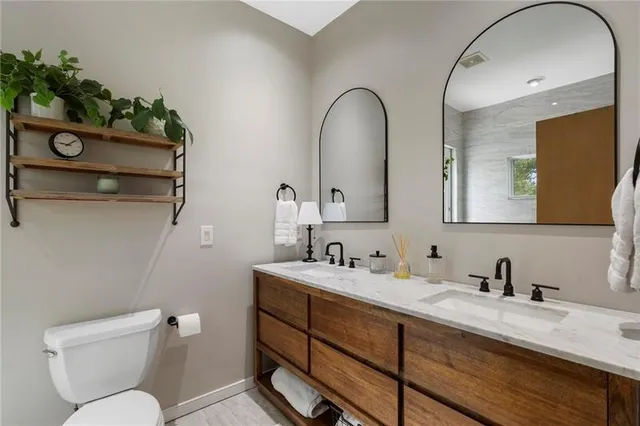 a bathroom with a window and a shower